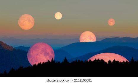 Many moons rise above the blue mountains "Elements of this image furnished by NASA" - Powered by Shutterstock