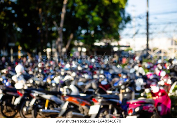 ฺBlur many motorbikes\
in the parking lot