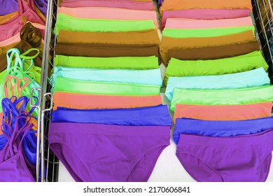 many multicolored panties for sale in the clothes stall at the market