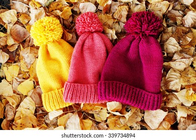 Many multicolored woolen knit hats