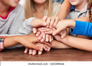 Many Multicultural Children Stack Hands As A Sign Of Integration