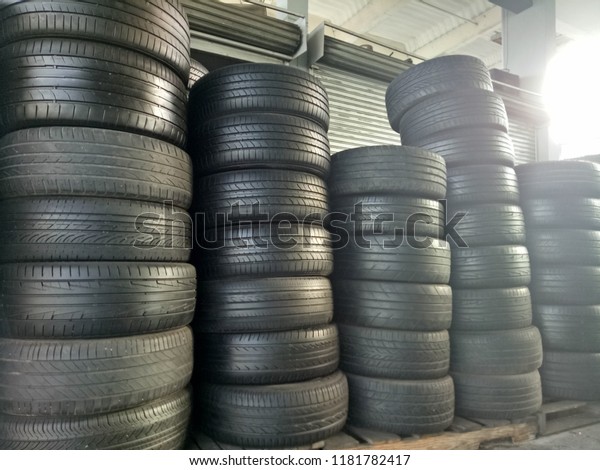 Many new and used car tires. Selective focus and space\
put your text. 