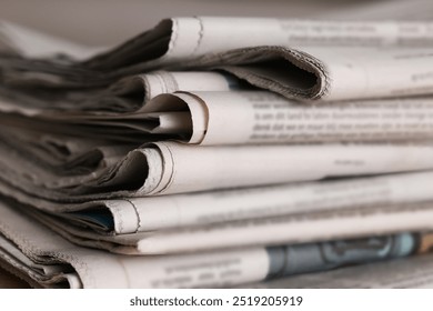 Many newspapers in different languages as background, closeup