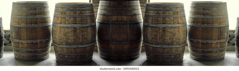 Many old aged wooden barrels with iron rusty  hoops in cellar, banner design. Wine or cognac barrels in winery, beer barrels. wine vaults. vintage oak barrels of craft brandy. standing on the floor - Powered by Shutterstock