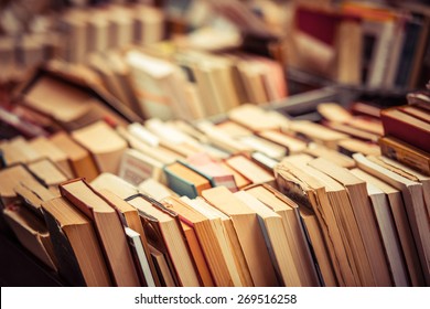 Many old books in a book shop or library. Shallow DOF