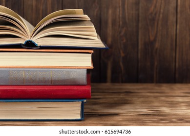 Many Old Books On Rustic Wooden Background. The Source Of Information. Knowledge Is Power
