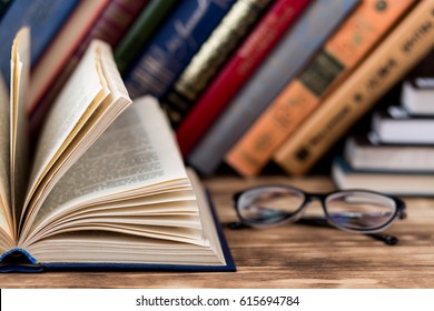 Many Old Books On Wooden Background. The Source Of Information. Knowledge Is Power
