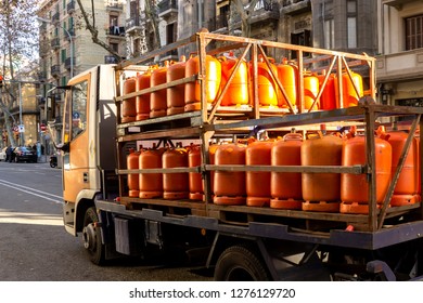 Many Orange Gas Cylinders Transported In Car