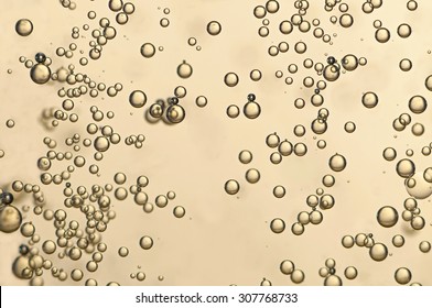 Many oxygen bubbles flowing in a wine glas