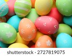 Many painted Easter eggs as background, top view