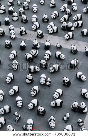 Many panda sculptures view from above that place on the floor is an art exhibition in Bangkok, Thailand.