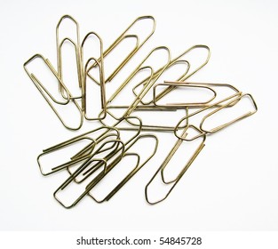 Many paper office clips on white background with soft shadows