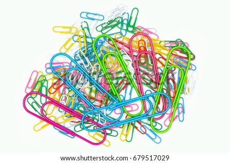 Similar – Colorful paper clips on a black board surface