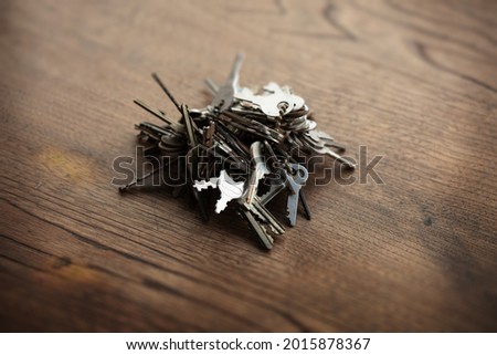 Too many password or security concept image.Bunch of tangled old keys on wooden table.Security and encryption, concept image.