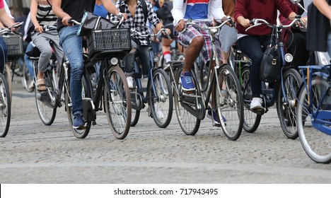 Many People Fast Riding Bicycles In Amsterdam In The Netherlands