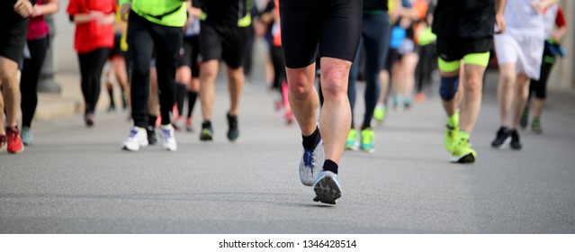 Many People At Footrace On The Road Of The City