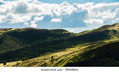 Many People Hiking On Mountain Landscape In Edinburgh, Scotland