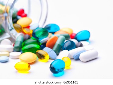 Many pills and tablets isolated on white background