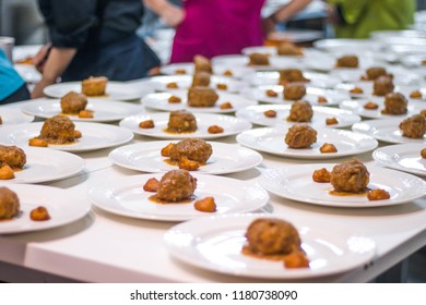 Many Plates Dish Of Meetballs Being Prepared In Commercial Industrial Professional Kitchen Galley For Event Party