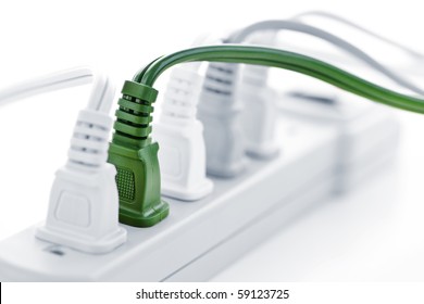 Many Plugs Plugged Into Electric Power Bar