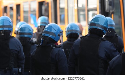 Many Policemen In Riot Gear Control Buses With Hooligans