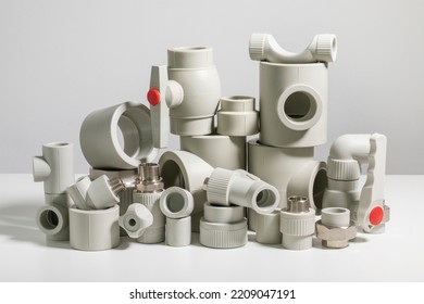 Many Polypropylene Pipe Fittings On The Table.