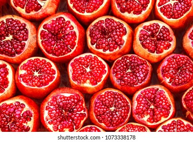 many pomegranate  cut in half, pomegranate background - Powered by Shutterstock