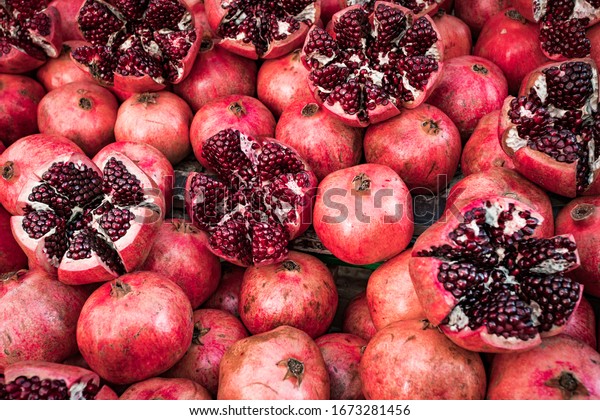 Many\
pomegranate cut in half, pomegranate\
background