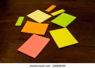 Many Post Its Lying On An Office Table In Different Vibrant Colors.