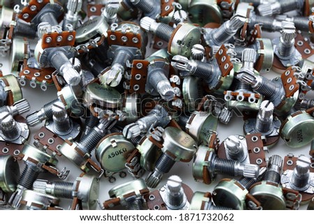 Many potentiometers. Heap of potentiometers, usually known as volume pot on white. 
