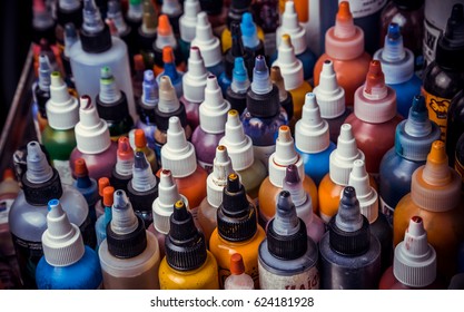 many professional bottles with colored ink for tattoos.