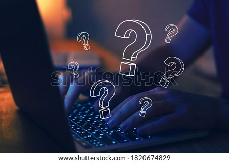 many quiestion marks on computer, find answer online, FAQ concept, what where when how and why, search information on internet