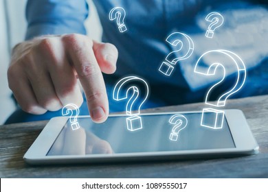 Many Quiestion Marks From The Screen Of Tablet Computer, Find Answer Online, FAQ Concept, What Where When How And Why, Search Information On Internet