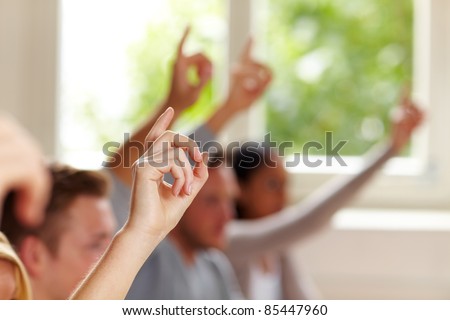 Many raised fingers in class at university