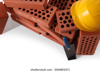 Many Red Bricks, Hard Hat And Trowel On White Background, Above View