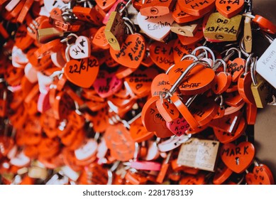 Many red locks in the form of hearts with the names of lovers. Near Juliet's house in Verona. Love, sympathy. hearts lock Italy