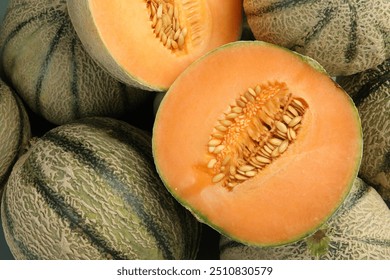 Many ripe Cantaloupe melons as background, top view