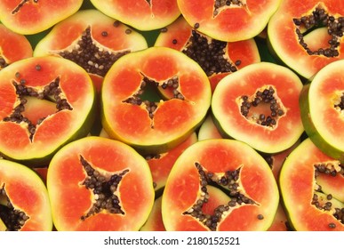 Many Ripe Red Papaya Slices Close Up