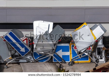 many road signs in grocery carts. road infrastructure. costs. Stock photo © 