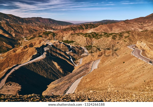 Many road turns in\
a famous mountain road Tizi N’Tichka in Atlas mountains Morocco\
Africa on sunny day