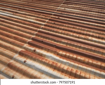 Many Roof Of Old House Are Made From Metal Sheet. Some Of Them Is Too Old And Become Rusty. It's Surface Was Damage And Got Beautiful Texture That Can Used For Decoration As Vintage Or Loft Style.