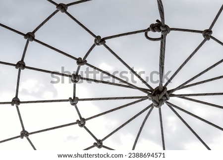 many ropes and one big knot black and white abstract background isolated close up