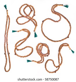 many rosaries on white background.