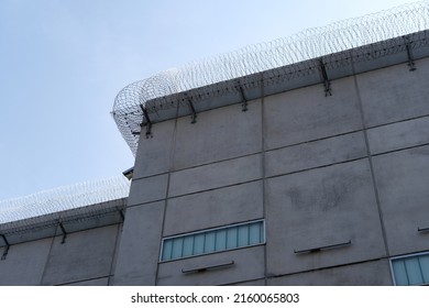 Many Rows Of Barbedwire, High Concrete Fence, Barbed Wire Fence On Top, Building For Execution Of Punishments For Criminals, Concept Prison, Security Zone, Symbol Of Bondage, Hopelessness Of Captivity