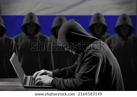Many russian hackers in troll farm. Cyber crime and security concept. Flag in background.