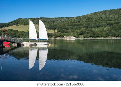 Many Sailboats Lined Up On The Beach