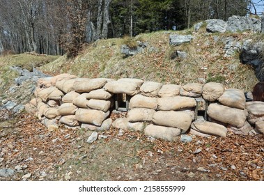 many sandbags of the trench dug into the rock for the protection of soldiers during the war