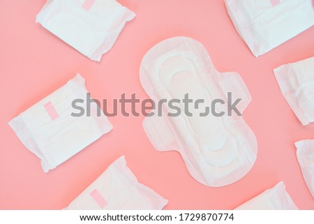 Many sanitary napkin on pink background