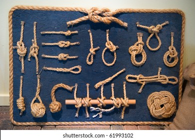 Many Ship Knots In Natural Rope On Blue Board