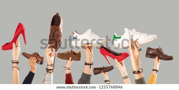 many shoes on arm raised\
hands